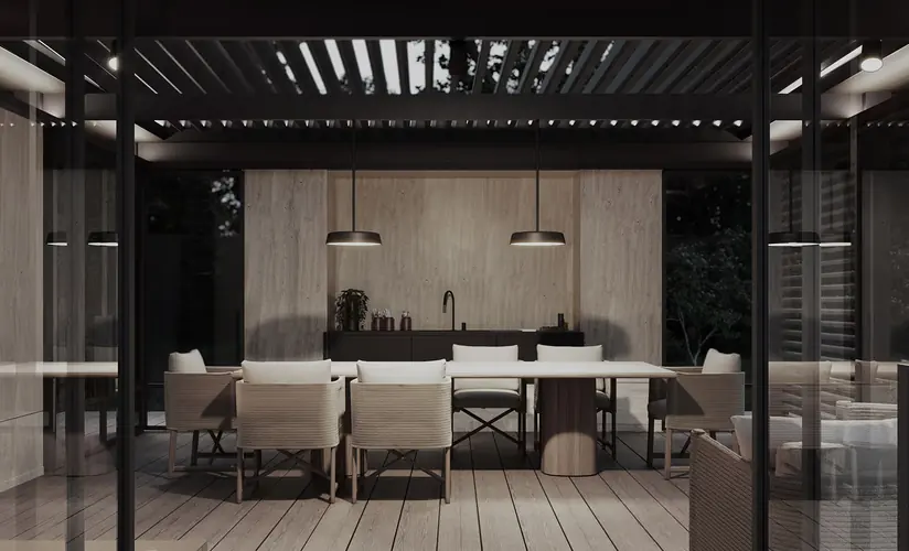 A pergola pavilion over a Tarimatec composite deck with a dining set