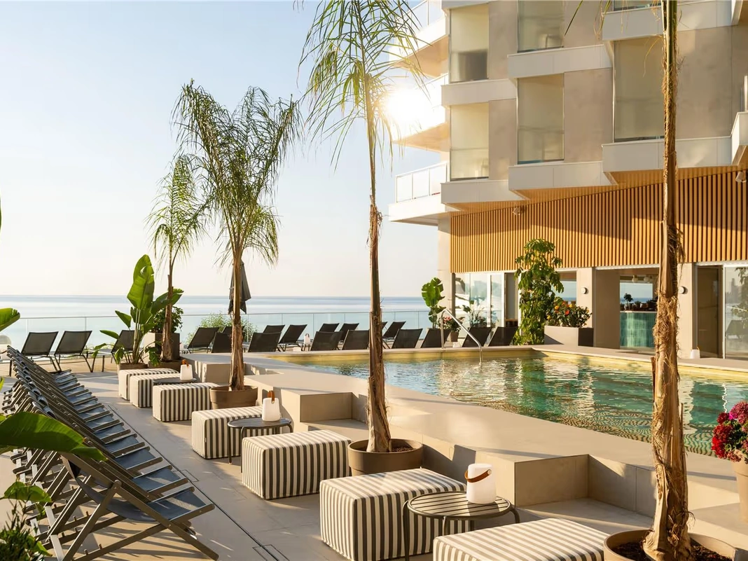 The sea-facing pool terrace at Hotel Spa Porta Maris by Meli&aacute;, Alicante