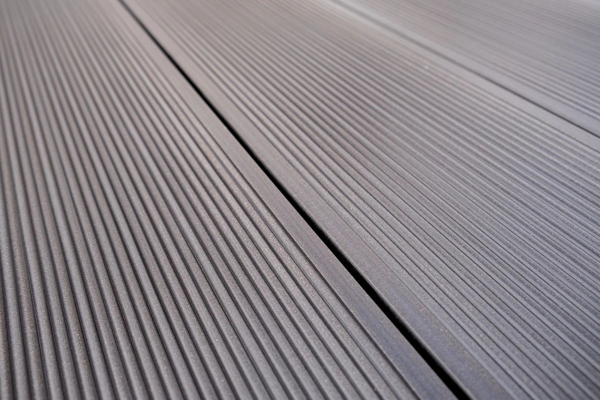 Macro photograph of the Tecno finish on a Wengue 2204 board: fine, evenly spaced grooves machined the length of the top face