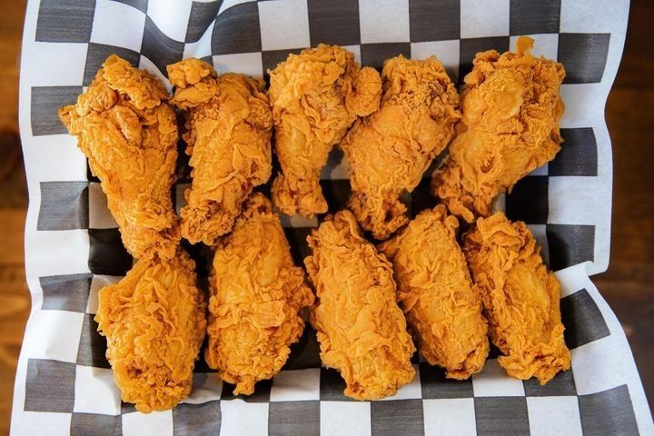 A plate of 10 double-battered crispy chicken wings.