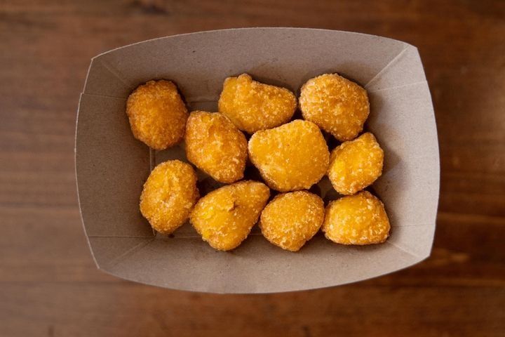 A serving of 10 golden-fried sweet corn nuggets.