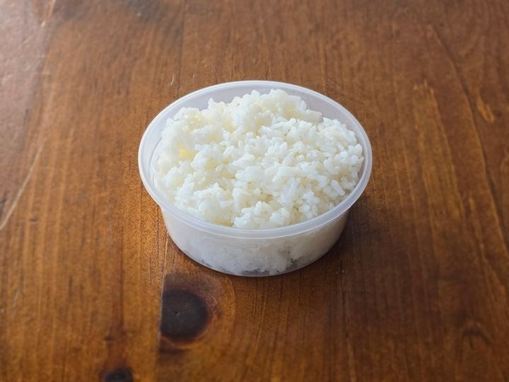 A bowl of steamed white rice.