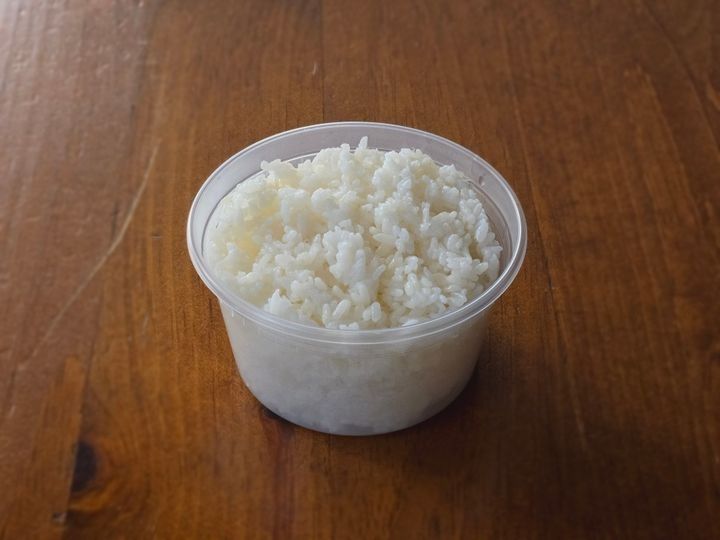 A bowl of steamed white rice.