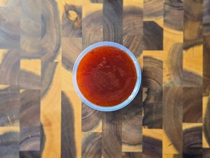 A serving of sweet Thai chili sauce.