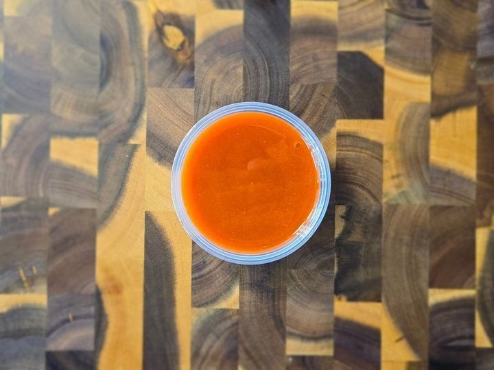 A serving of tangy buffalo sauce.