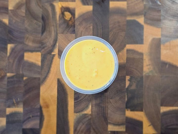 A serving of creamy, spicy ranch dipping sauce.