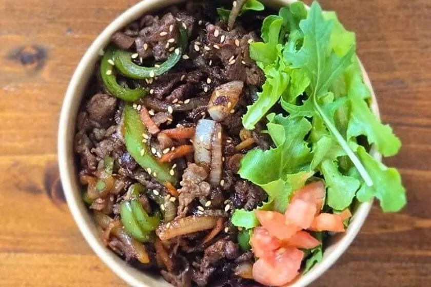 Our classic soy-marinated beef rice bowl, served with fresh salad and kimchi. A perfect meal for $15.99!