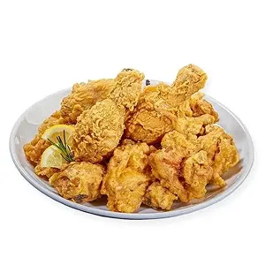 A large platter of 14 pieces of mixed double-battered fried chicken.