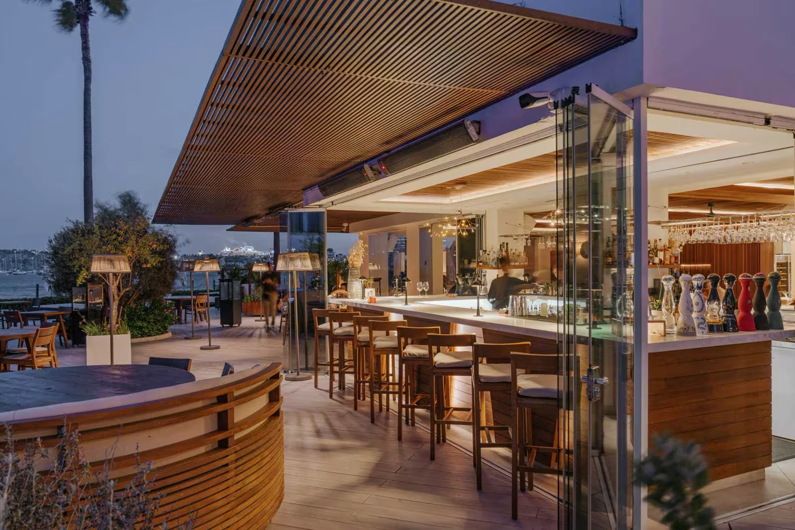 The Nobu restaurant bar terrace at Nobu Hotel Ibiza Bay under a timber-slatted canopy