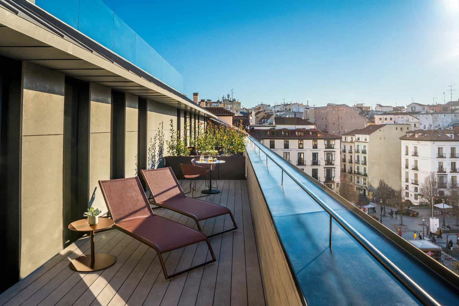 A corner deluxe room terrace at Ocean Drive Madrid, decked in warm composite boards