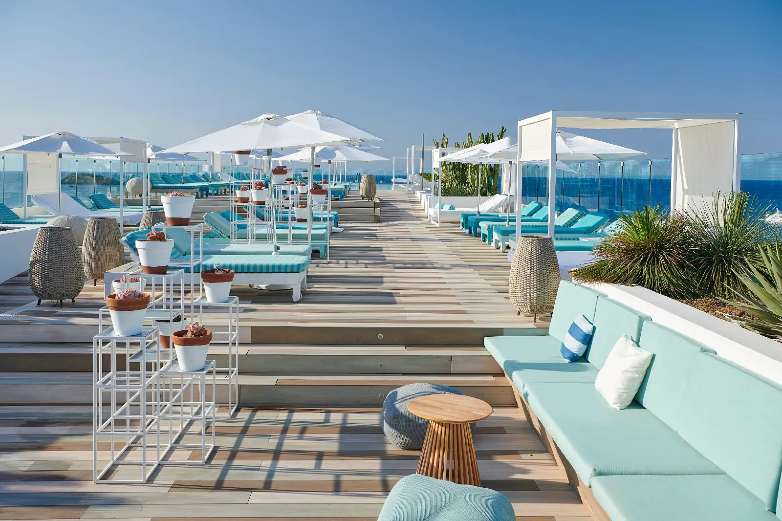 Loungers and cabanas along the striped deck at Iberostar Selection Santa Eulalia, Ibiza