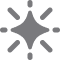 Sparkle or star icon with radiating points on a gray background