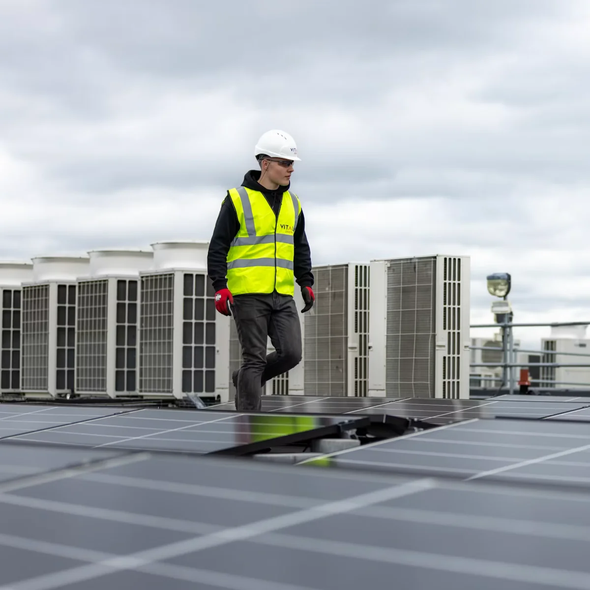 HVAC technician working on rooftop equipment