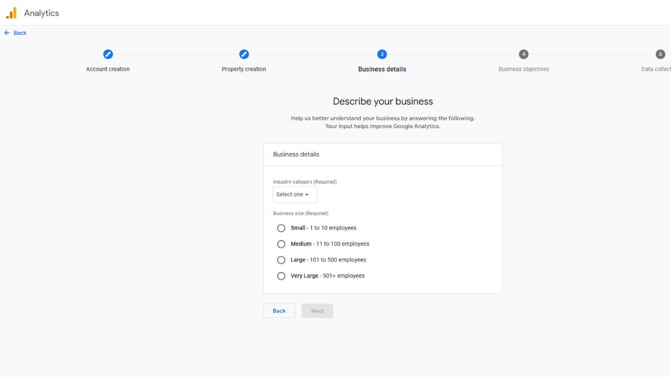 Google Analytics 4 business details screen with industry category dropdown and business size selection options