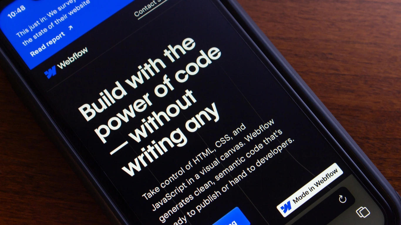 martphone screen showing Webflow visual development capabilities without writing code