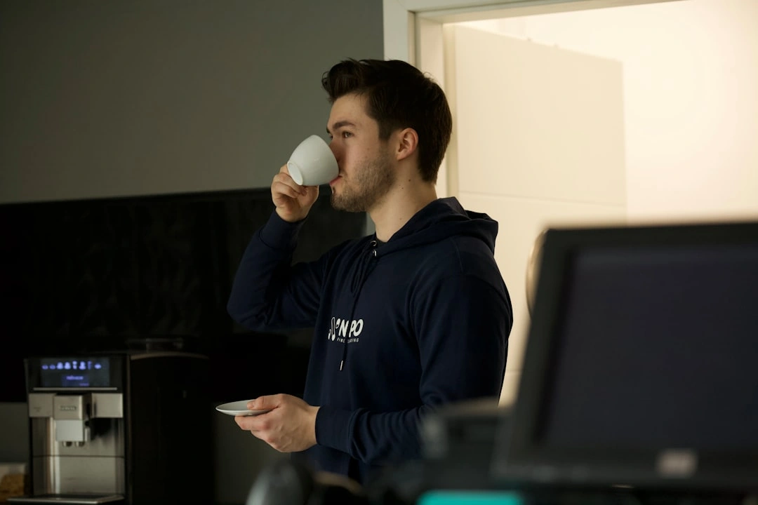 An employee taking a quick coffee break during a shift An employee taking a quick coffee break during a shift