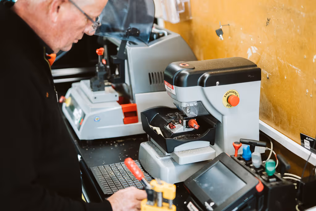 A Tasmanian Mobile Locksmith van parked beside a Hobart business.
