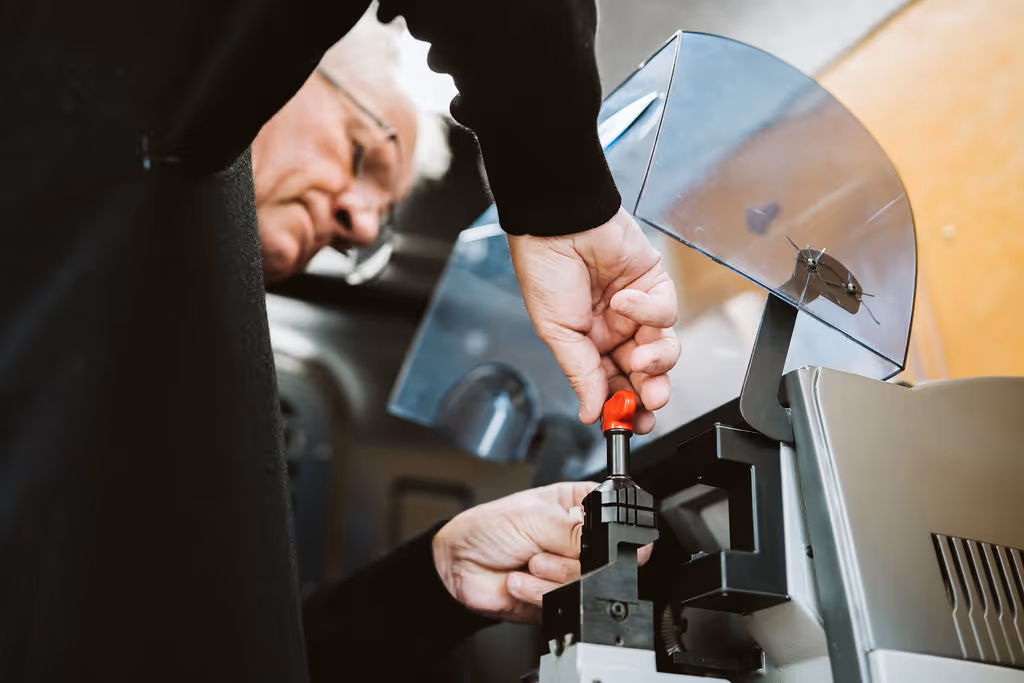 One of our Master locksmiths working on a heavy-duty security device in his work van.