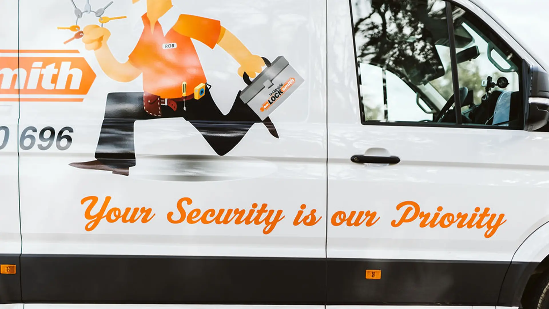 The side of our van, with a slogan reading, “Your security is our priority”. As veteran government locksmiths in Hobart, that’s absolutely true.