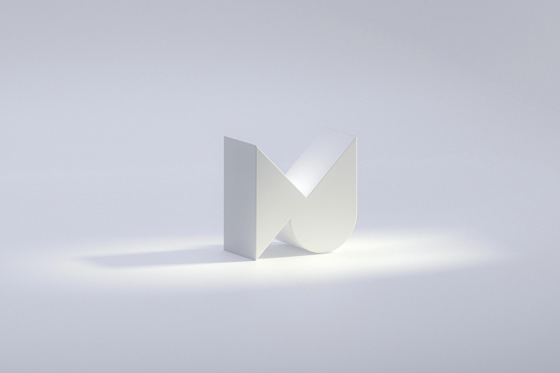 White geometric sculpture under soft lighting.
