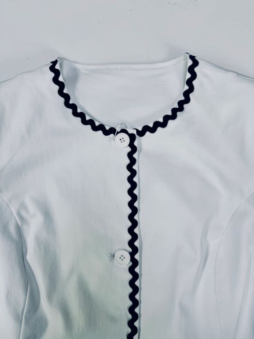 woven jacket featuring custom lace trim design