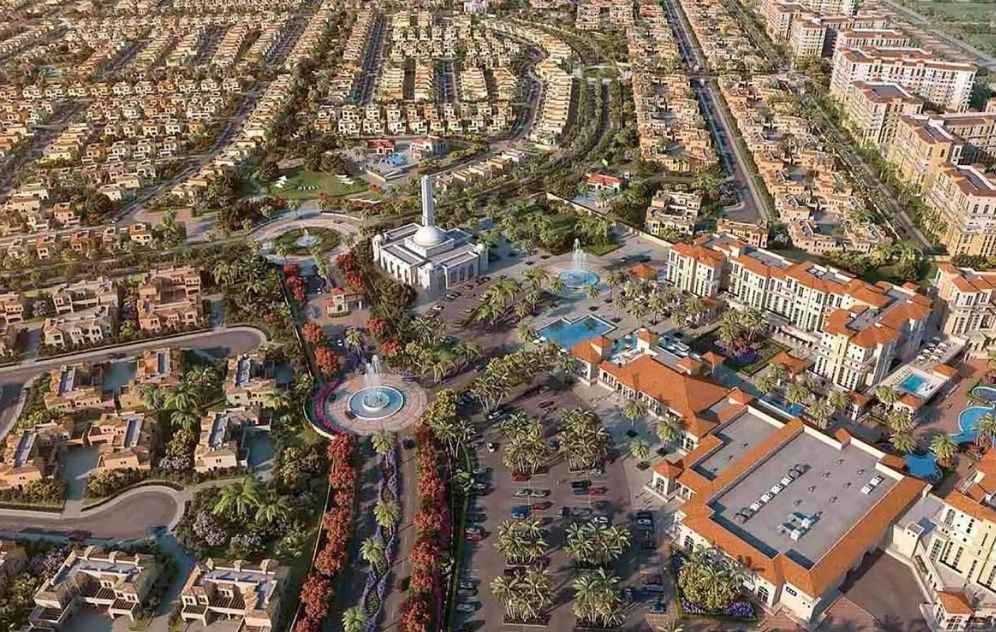 Aerial view of residential community in Dubailand Dubai with villas and greenery