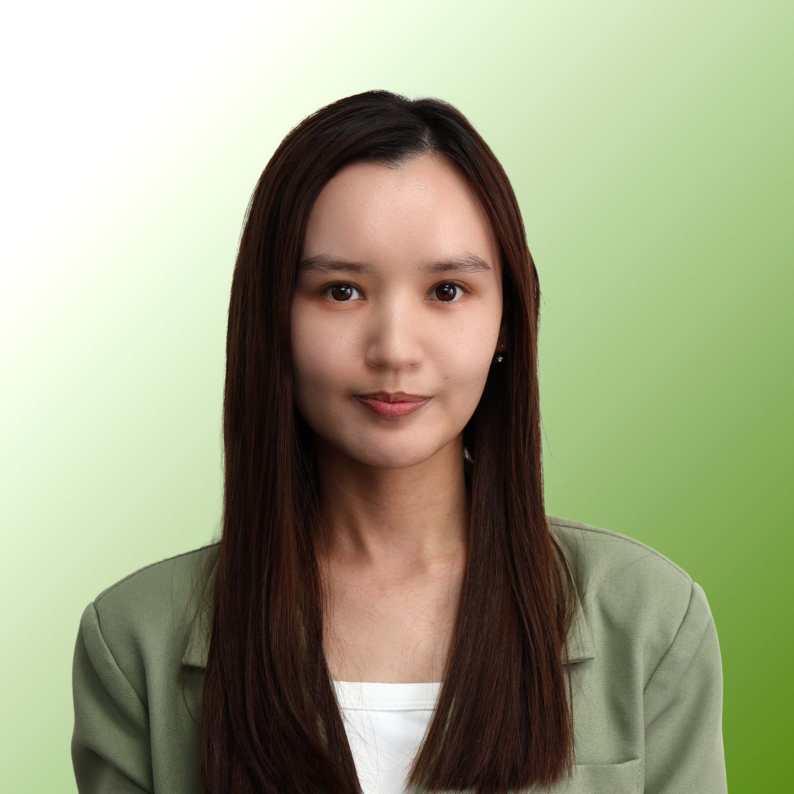 Portrait of a young woman with long straight dark hair wearing a light green blazer and white top, against a green gradient background.