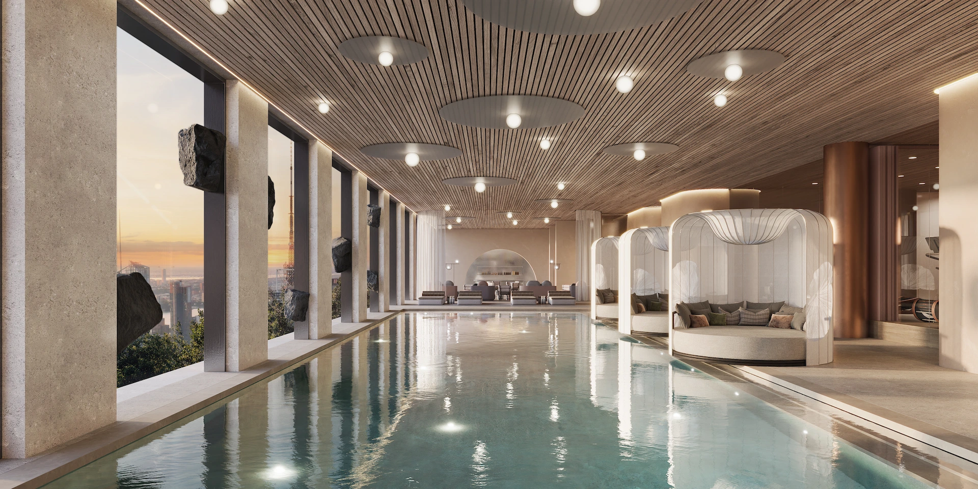 Modern indoor luxury pool with panoramic city view, wood slatted ceiling, sculptural stone columns, and elegant canopy lounge beds