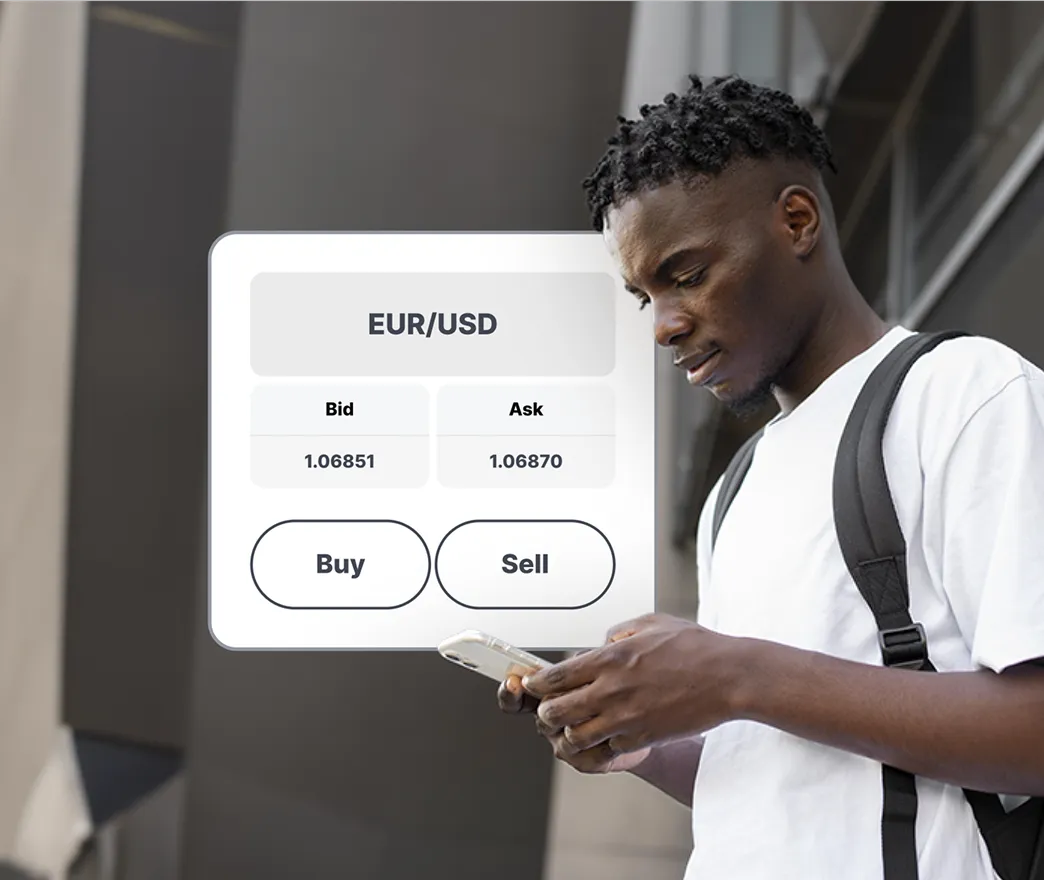Man trading on a mobile device, displaying a buy and sell interface with bid and ask prices.