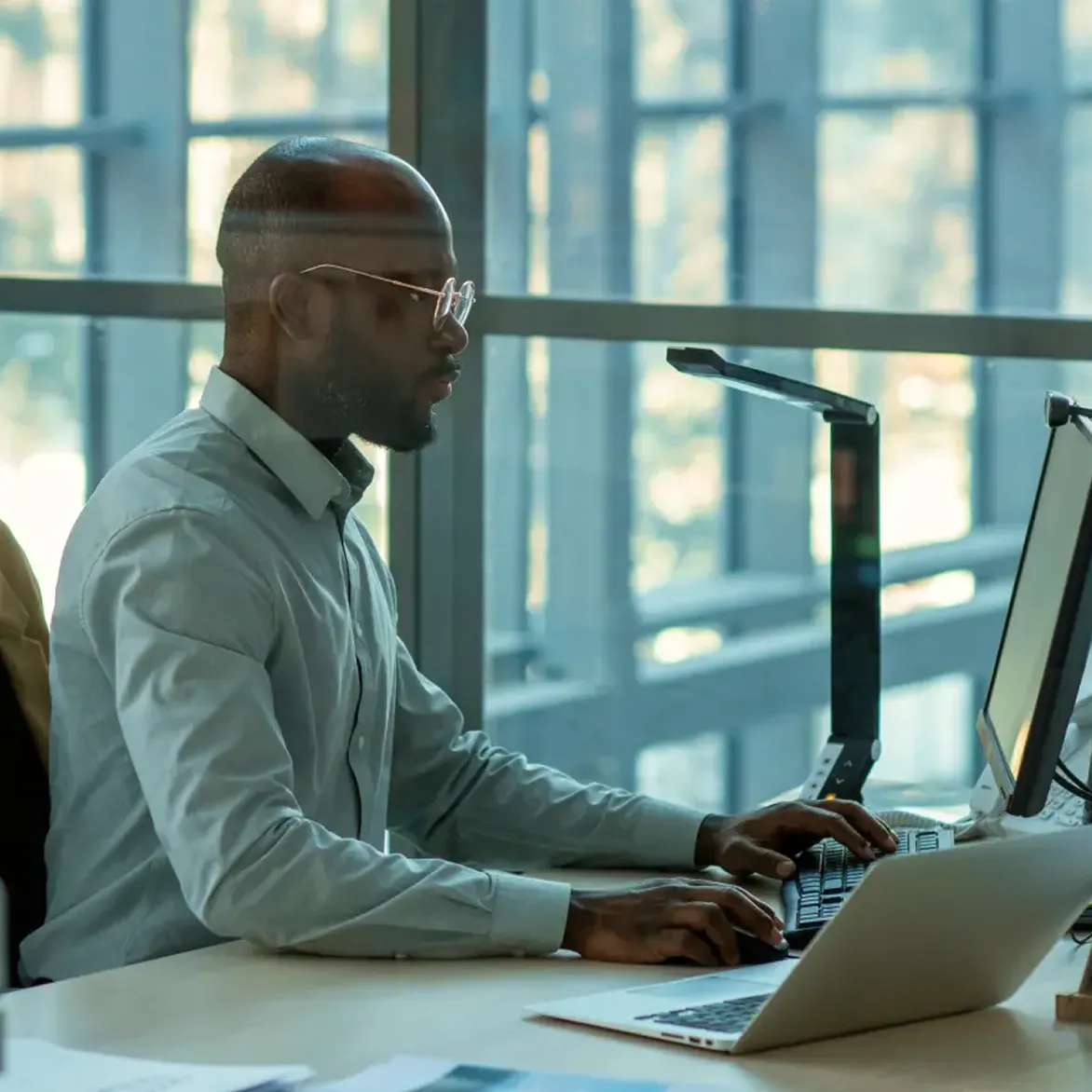 Deriv MT5 dashboard displayed on a laptop,tablet and mobile showing market charts and trading tools for forex and CFD trading analysis.