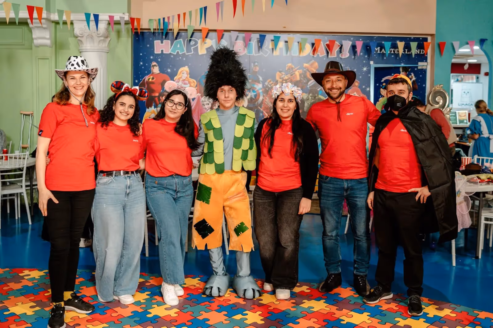 Deriv team on different costumes for kids to enjoy at One Dream, One Wish Cyprus hosting a carnival event for kids