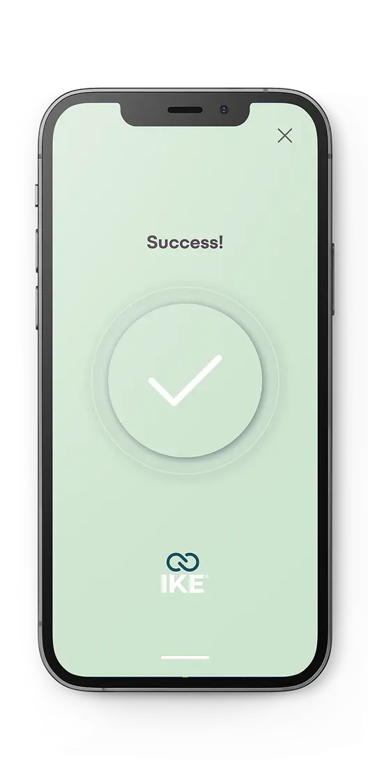 Smartphone screen showing a green success message with a white check mark and the text 'Success!' above the IKE logo.