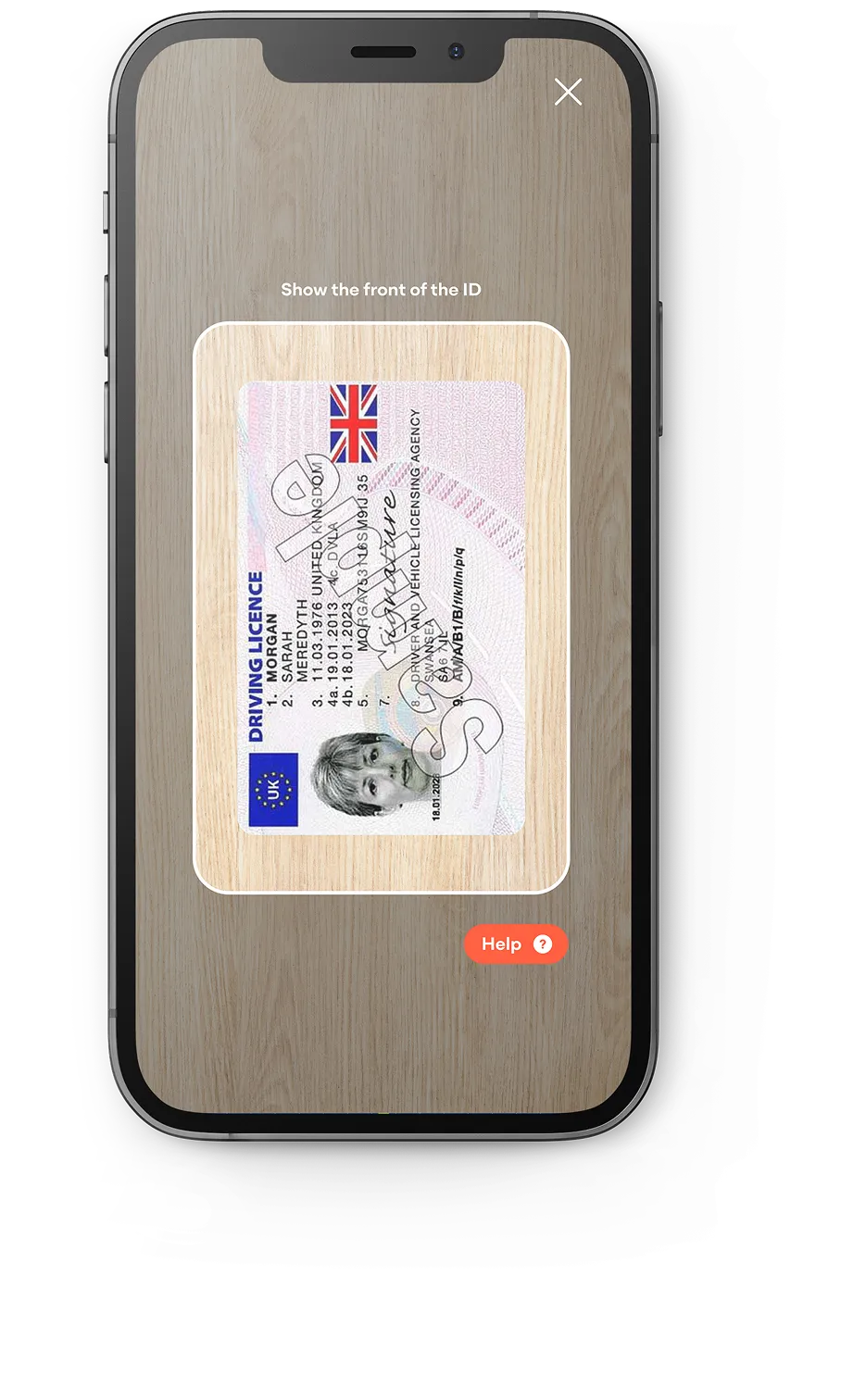 Smartphone screen showing an app scanning the front of a UK driving license with a female photo and text instructions to show the front of the ID.