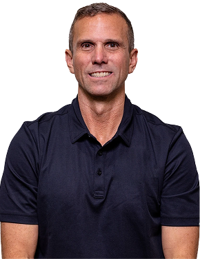 Smiling middle-aged man with short brown hair wearing a black polo shirt against a transparent background.