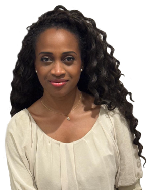 Smiling woman with long curly hair wearing a cream blouse and a delicate necklace.