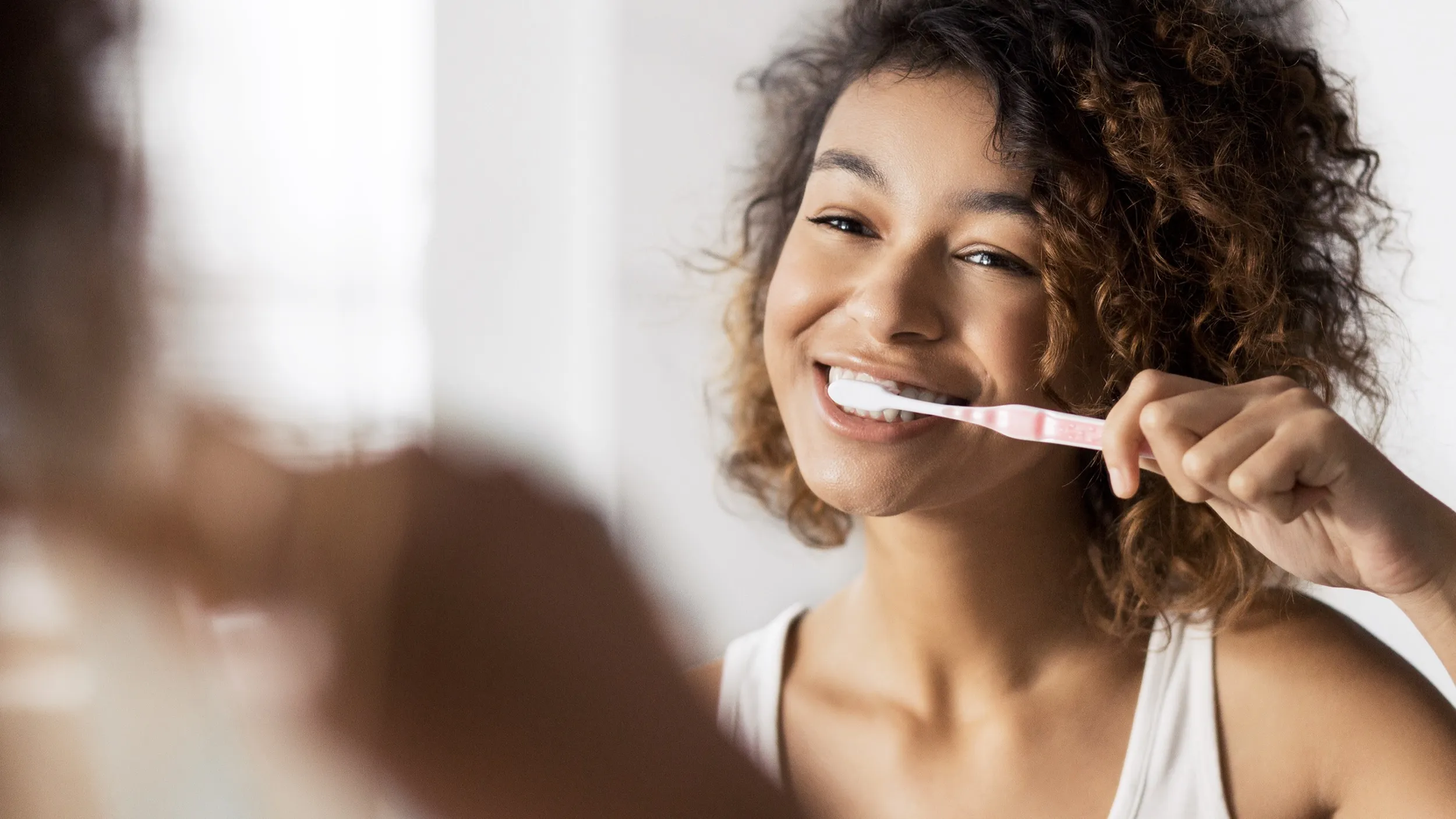 Women brushing their teeth