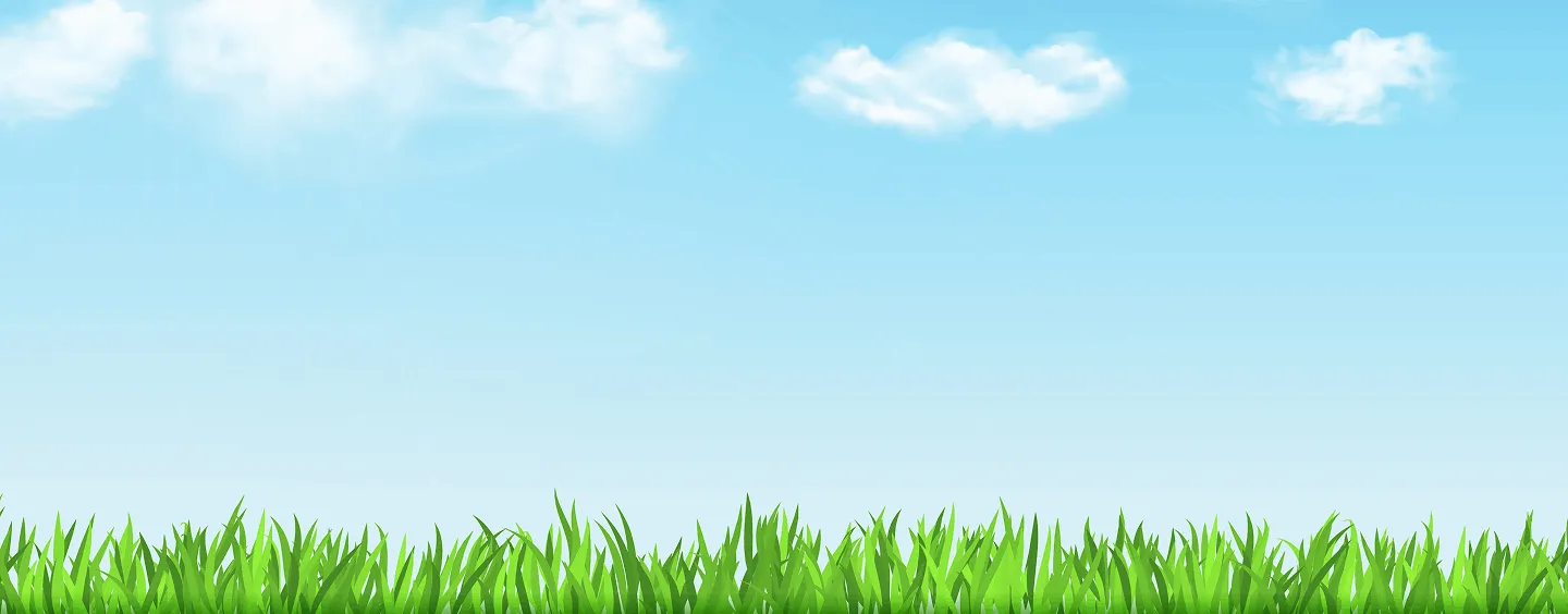 Bright blue sky with sun rays and a few white clouds above green grass blades.