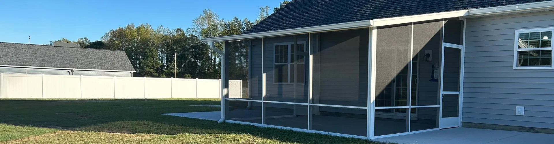 covered patio with tables and chairs