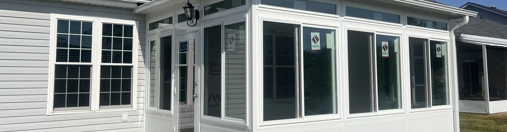covered patio with tables and chairs