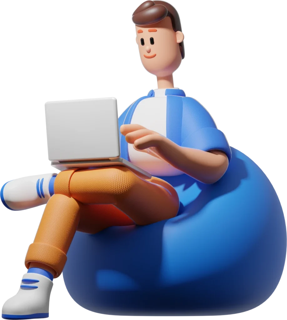 Une personne utilisant un ordinateur portable, assis sur un pouf