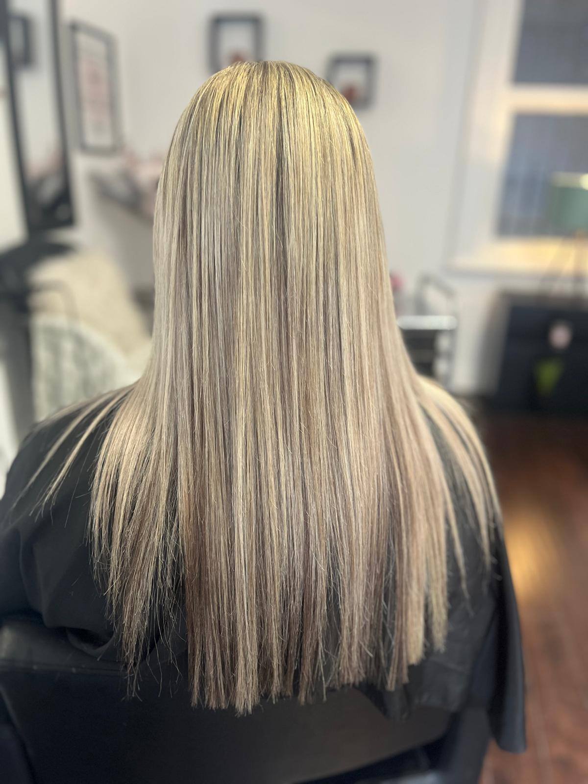 Blonde highlights with sleek straight finish at Hair by Jade salon Belfast