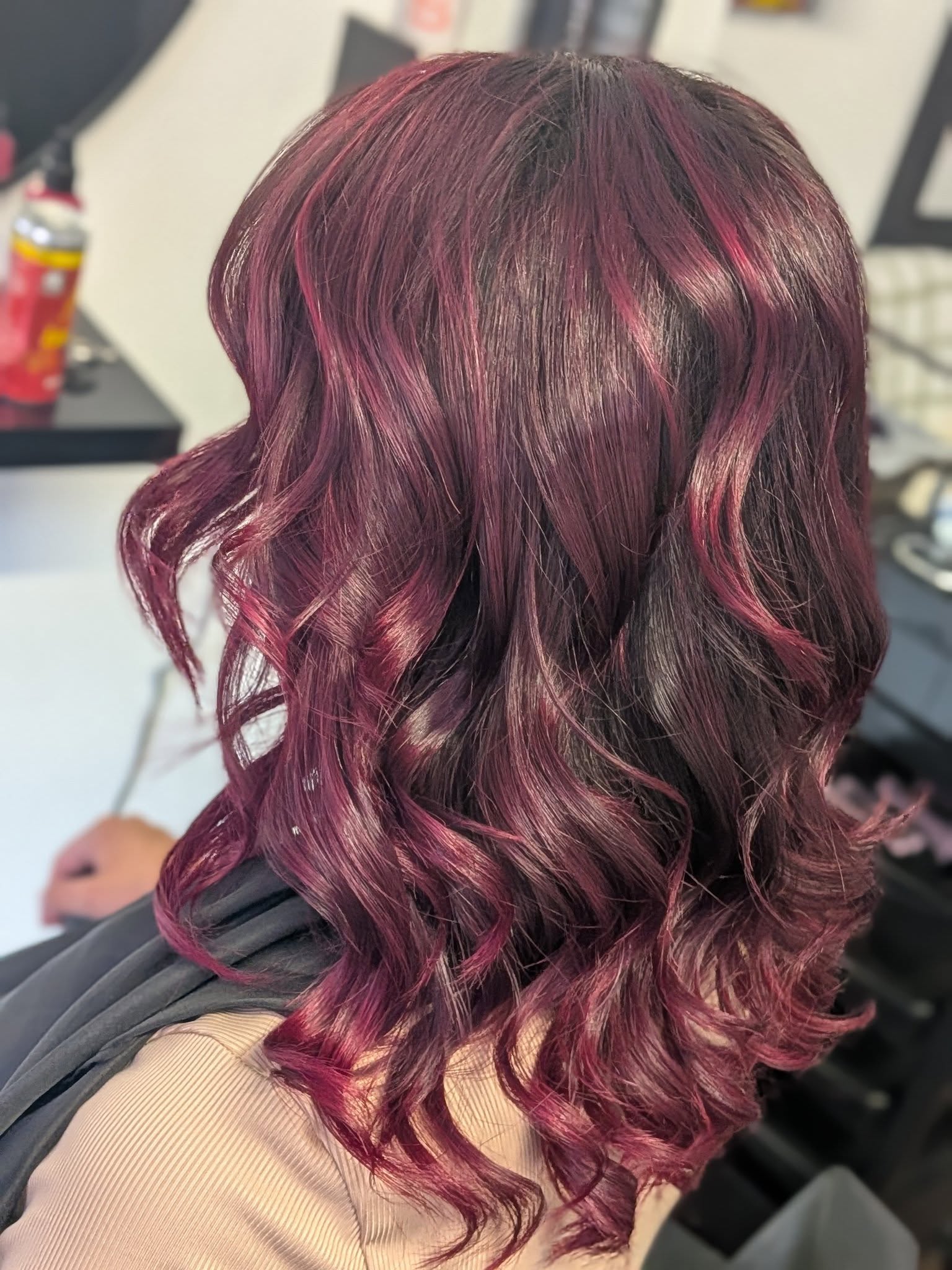 After — vibrant deep red wavy hair with glossy shine after colour refresh, Belfast stylist