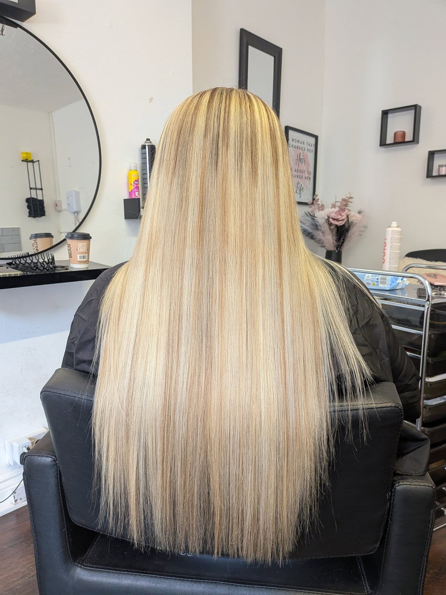 Long blonde hair extensions in Belfast salon for natural length and volume at Hair by Jade
