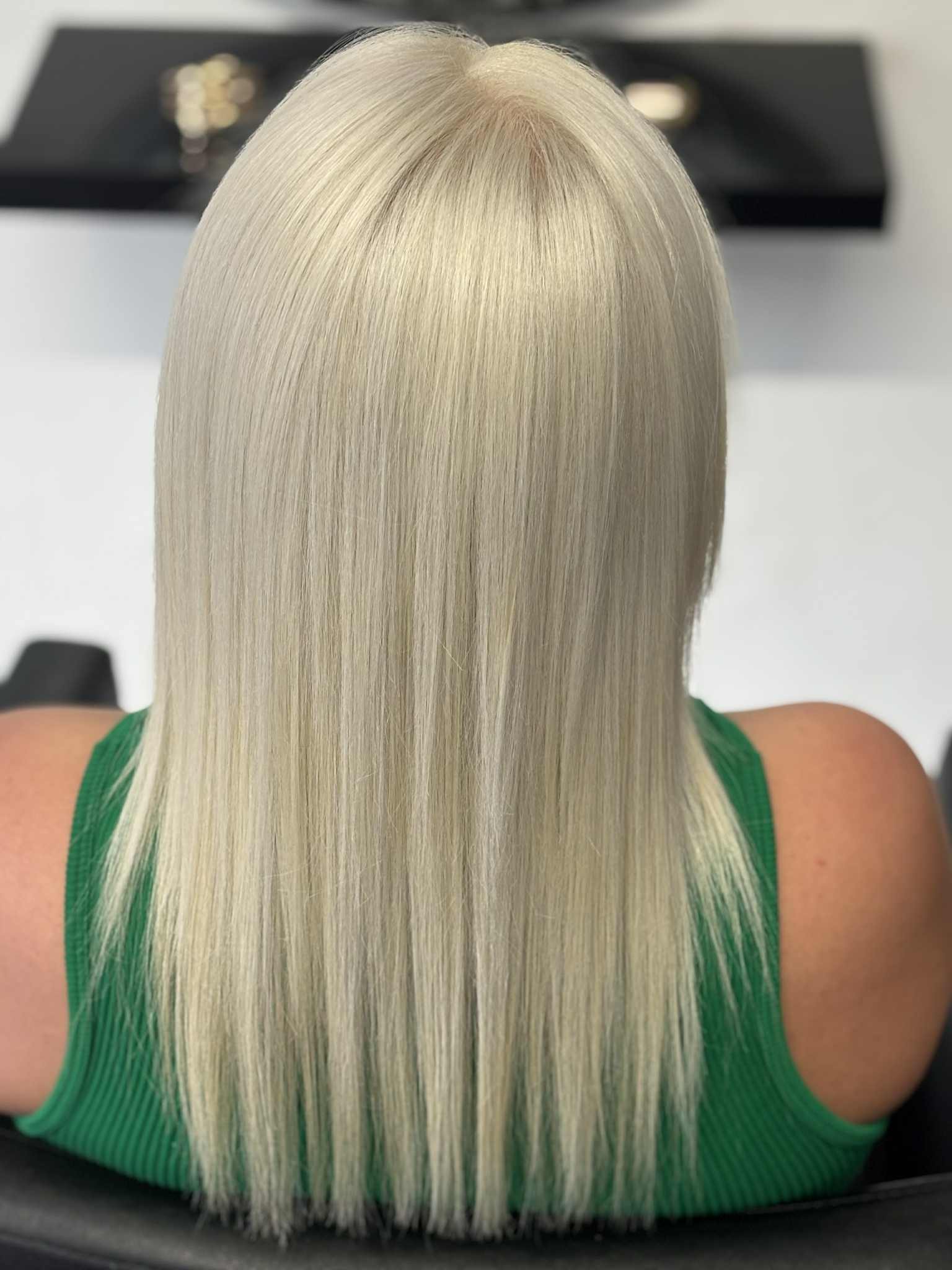 Icy platinum blonde straight hair Belfast – precision colouring and cut at Hair by Jade.