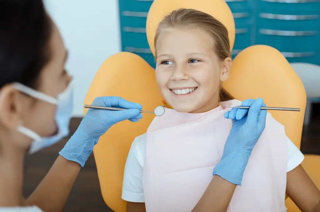 Happy young girl after treatment at Pinnacle Pediatric Dentistry Houston with a bright, healthy smile – pediatric dentist in Houston