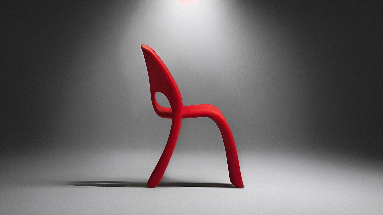 Vizcom AI render of an organic red chair concept with flowing curves under dramatic studio spotlight