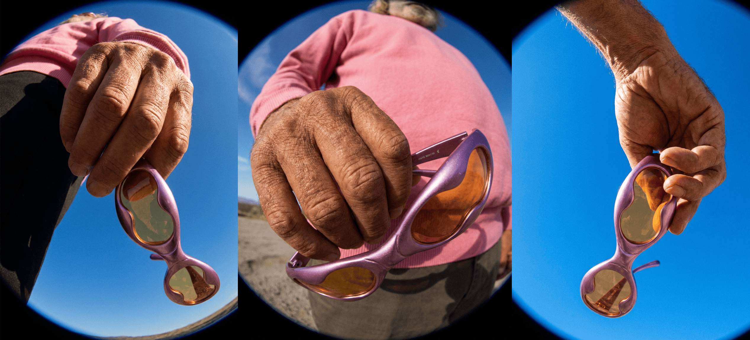 low angle shot of person holding sunglasess upclose