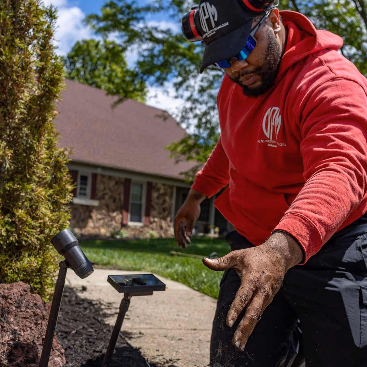 Owens Property Managers team maintaining residential lawn near me