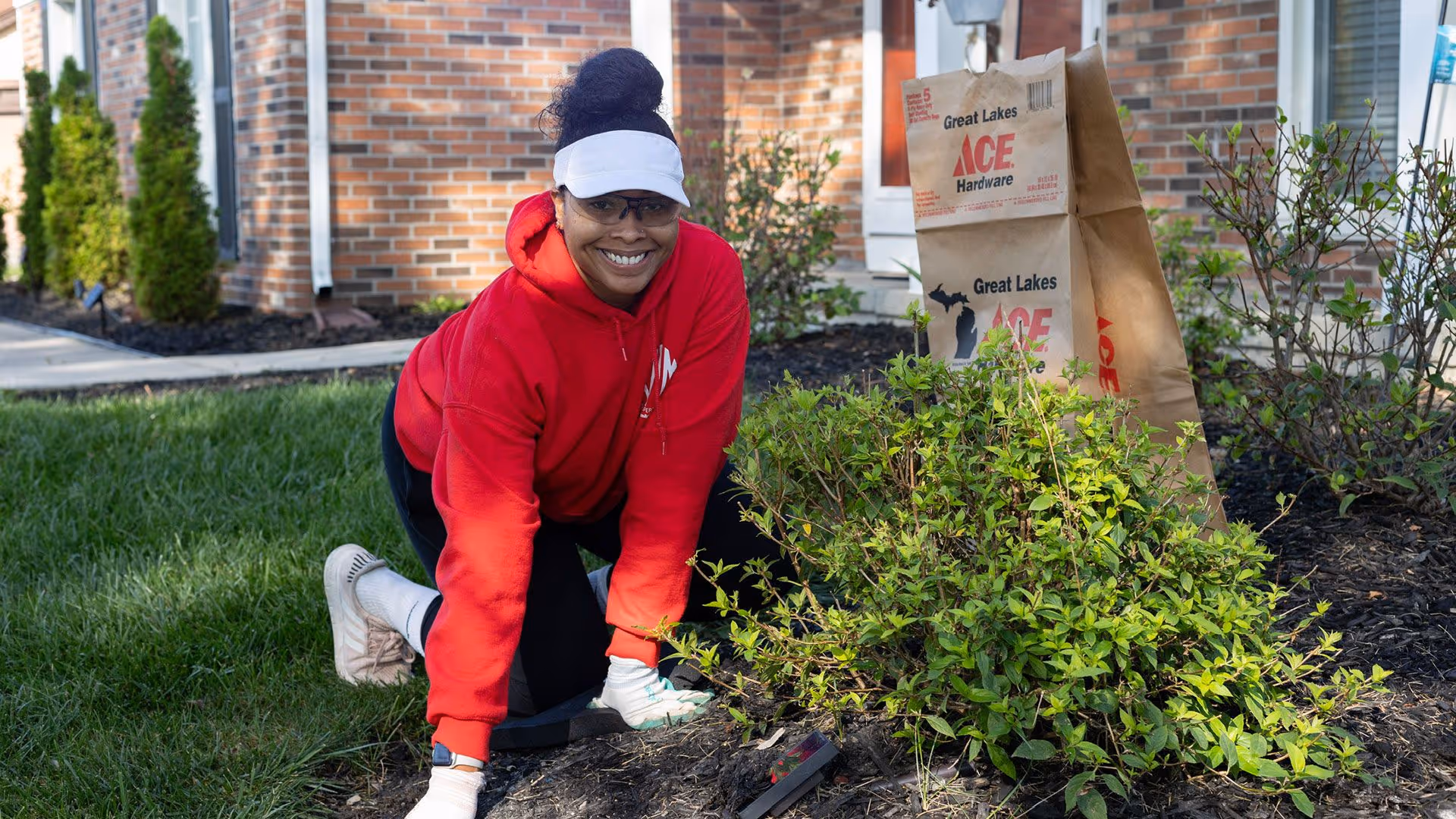 Crew maintaining residential landscaping in Royal Oak MI