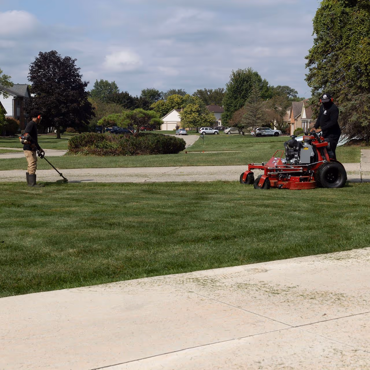 Lawn mowing crew maintaining property in Metro Detroit